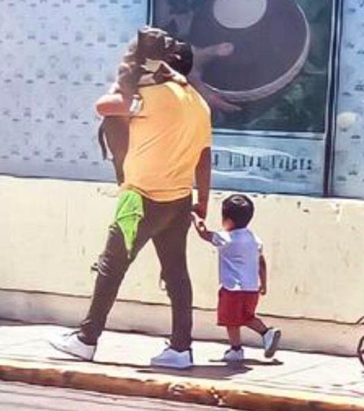 Father Prioritizes Dog Over Son: Chooses to Carry Pet Instead